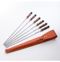 A set of skewers 670*12*3 mm in an orange leather case